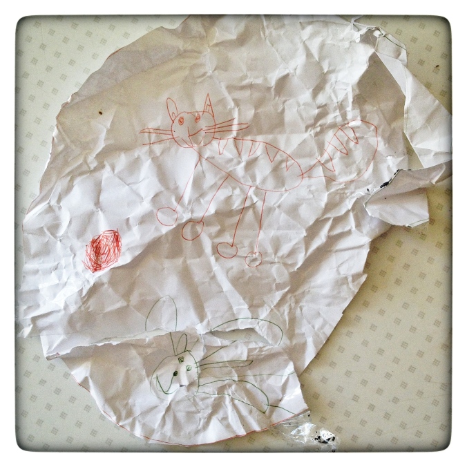 A child's drawing torn and crumpled by a bitter, damaged person